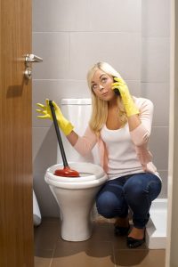 plunger-woman-call-plumber