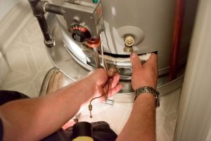technician-inspecting-water-heater