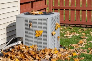outdoor-AC-unit-covered-in-autumn-leaves
