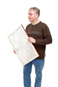 person-holding-replacement-air-filter